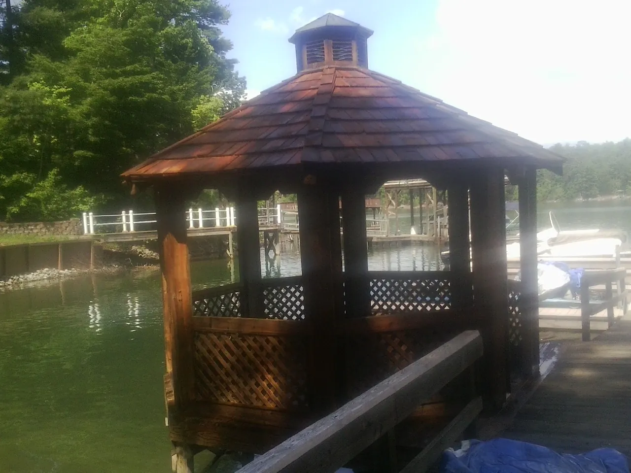 Cedar shake gazebo roof rebuilt on a lake dock in Gaylord